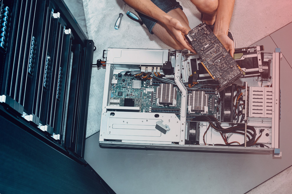 overhead view of someone taking apart a computer